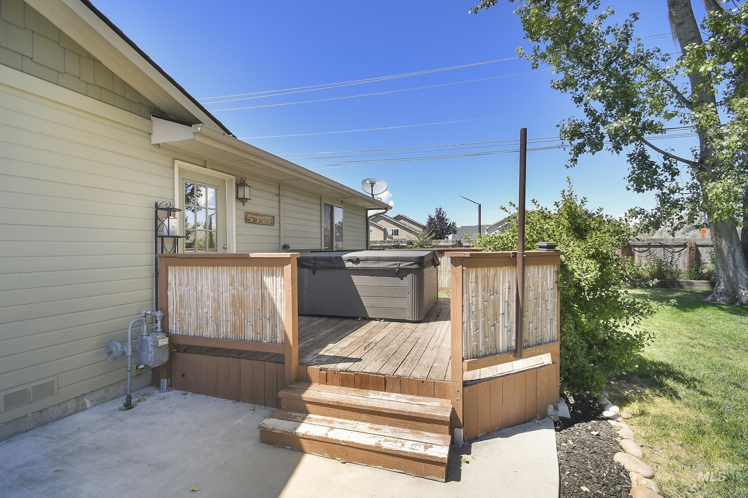 1108 East Ustick Road Caldwell, ID 83607 - Photo 28 of 30 Wood-finish deck featuring a built-in hot tub