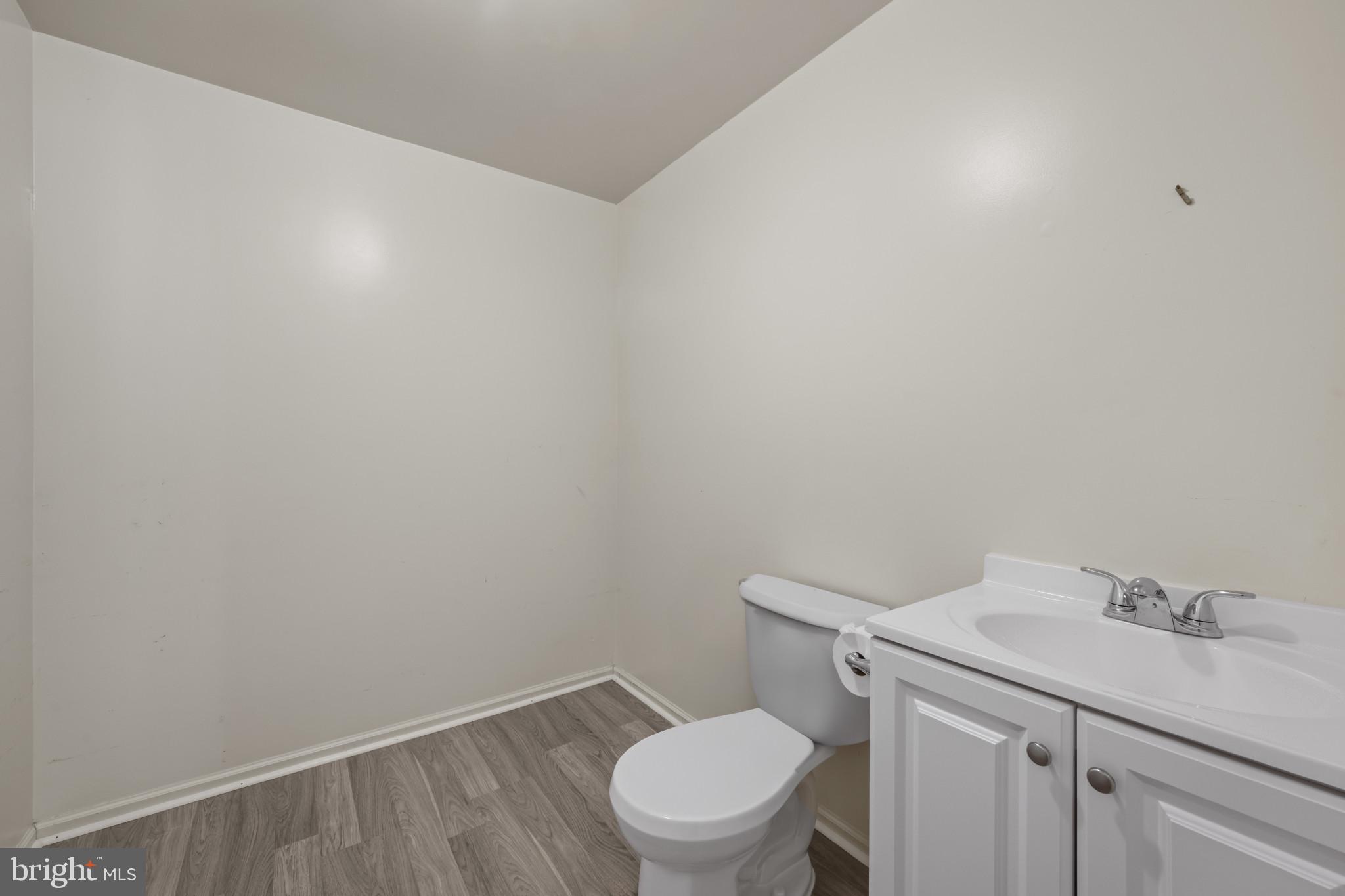 4031 Forest Valley Road Baltimore, MD 21234 - Photo 20 of 30 a bathroom with a sink and toilet