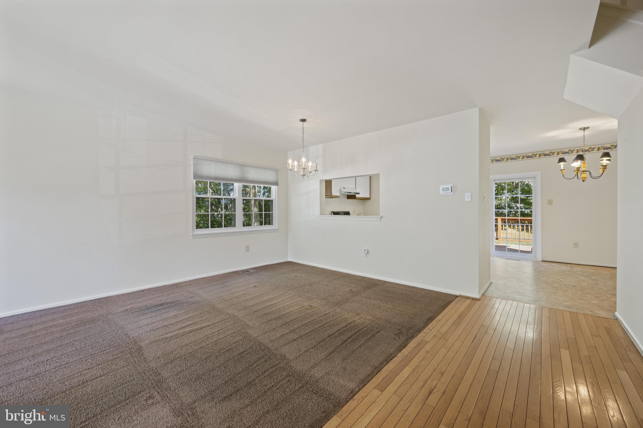4031 Forest Valley Road Baltimore, MD 21234 - Photo 3 of 30 wooden floor in an empty room with a window
