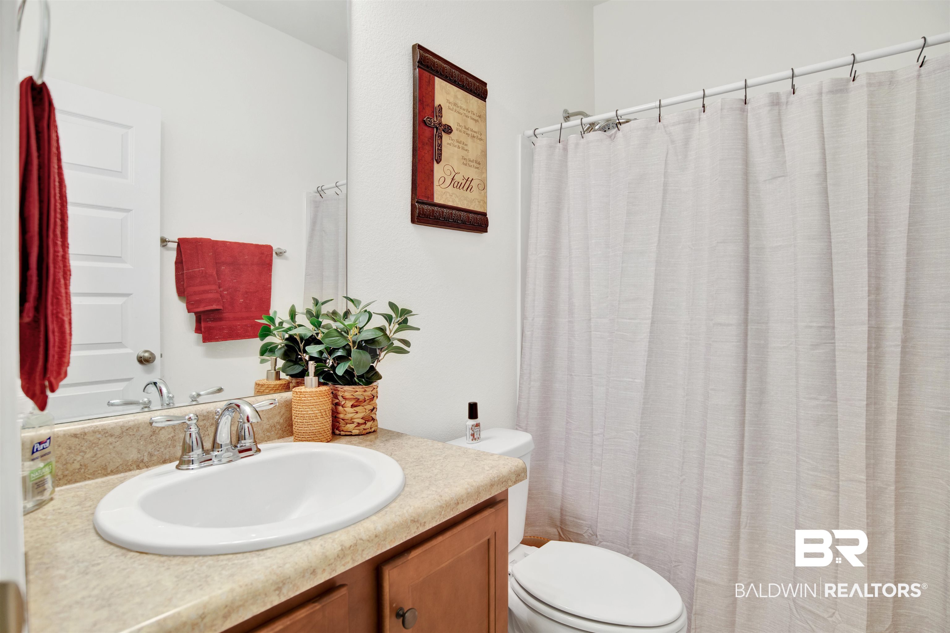 1468 Surrey Loop Foley, AL 36535 - Photo 18 of 28 Full bath with toilet, vanity, and a shower with shower curtain