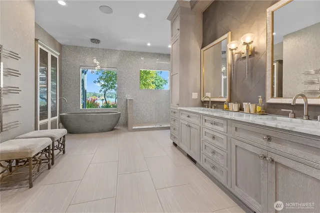a spacious bathroom with a granite countertop tub sink and mirror