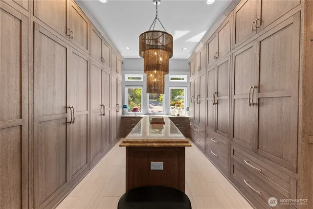 a kitchen with a sink and a chandelier