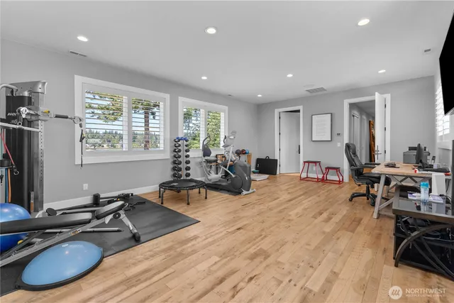 a living room with furniture a flat screen tv and a large window