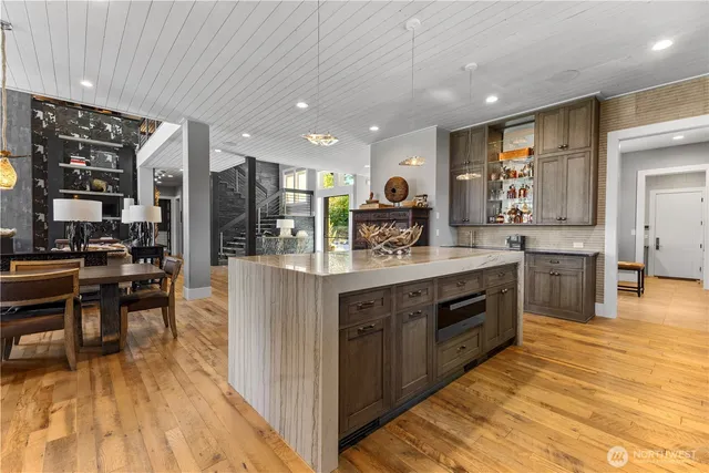 a kitchen with stainless steel appliances granite countertop a sink counter space and cabinets