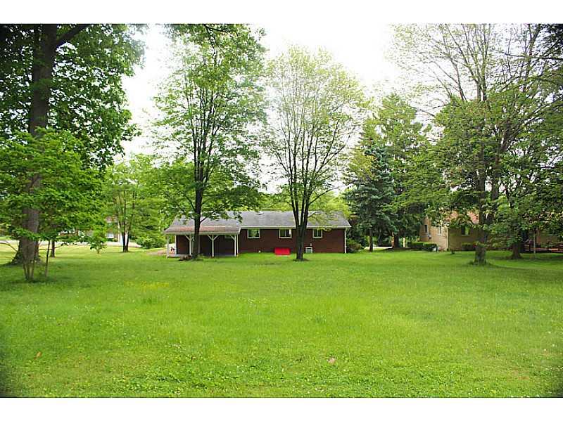 354 Old Plank Road Butler, PA 16002 - Photo 17 of 18 Exterior Back. Picture taken from shed in back yard looking at rear of home. Level wooded flat back yard