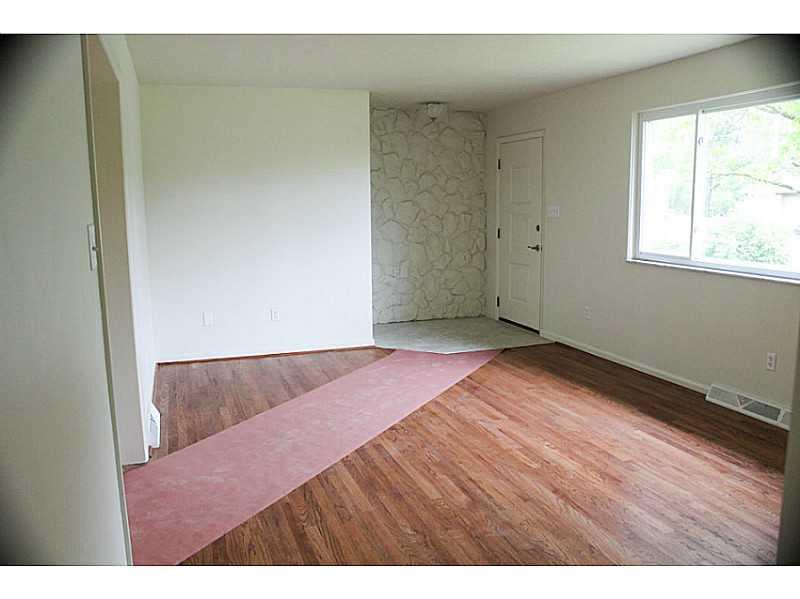 354 Old Plank Road Butler, PA 16002 - Photo 6 of 18 Living Room. Very large living room with picture window, newly sanded solid hardwood floors