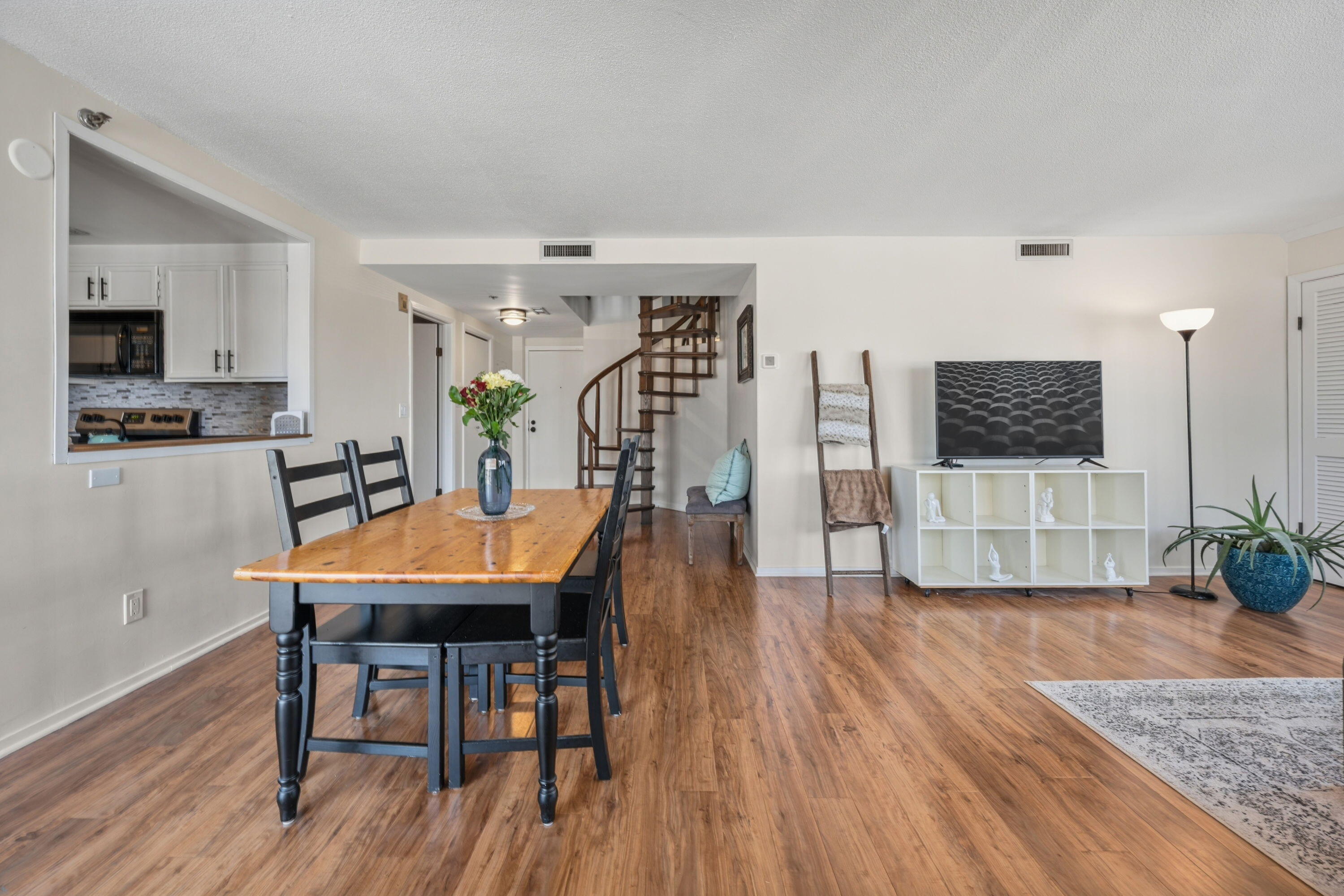 1633 North Prospect Avenue, Unit 5D Milwaukee, WI 53202 - Photo 8 of 38 The dining area sits at the center of the main level, connecting the kitchen, living room, and staircase with an easy everyday flow.