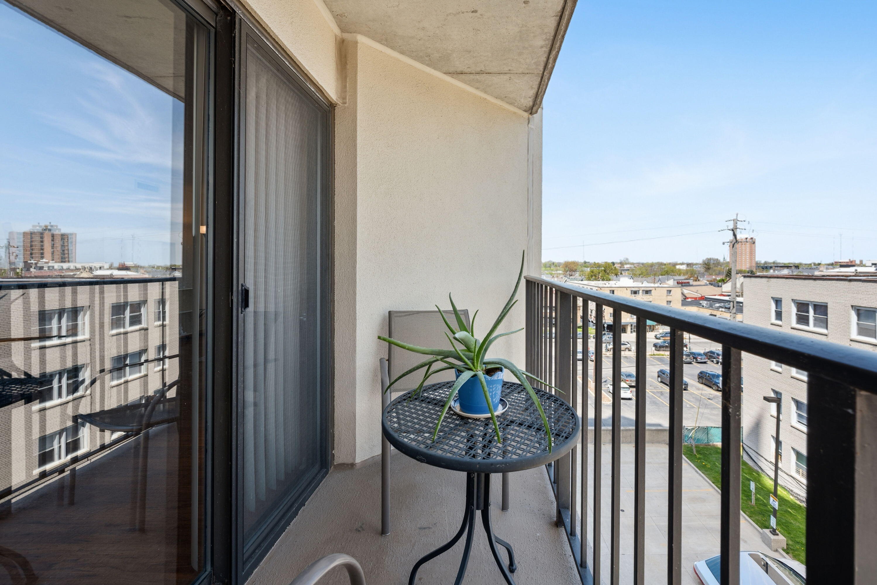 1633 North Prospect Avenue, Unit 5D Milwaukee, WI 53202 - Photo 15 of 38 Step outside from the main level for a quick breath of fresh air, city views, or a quiet coffee moment.