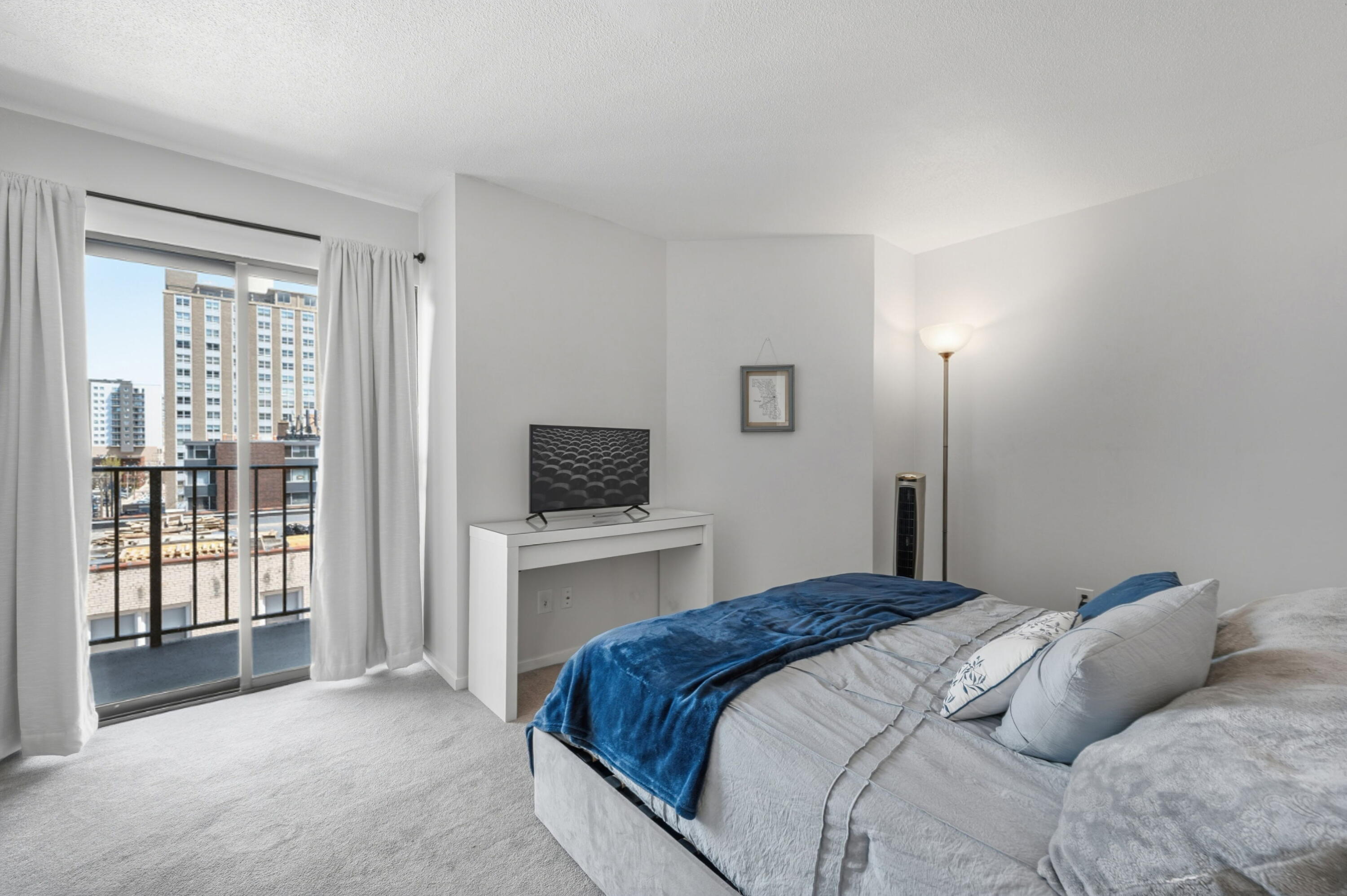 1633 North Prospect Avenue, Unit 5D Milwaukee, WI 53202 - Photo 21 of 38 This second-floor bedroom opens to its own balcony, creating a private-feeling spot for morning light or evening air.