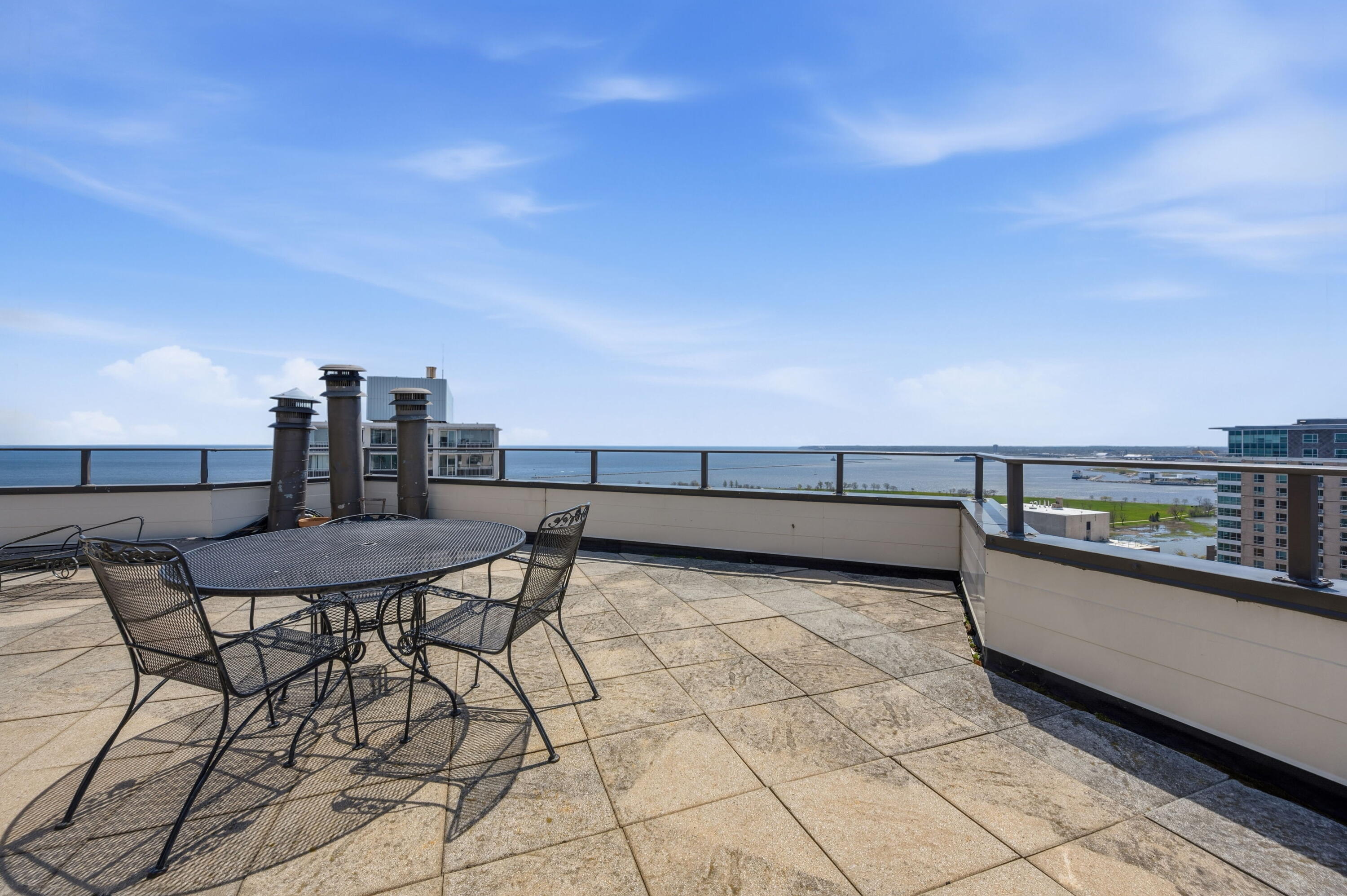 1633 North Prospect Avenue, Unit 5D Milwaukee, WI 53202 - Photo 25 of 38 The communal terrace gives you space to sit, breathe, and take in Lake Michigan views from high above Prospect Ave.