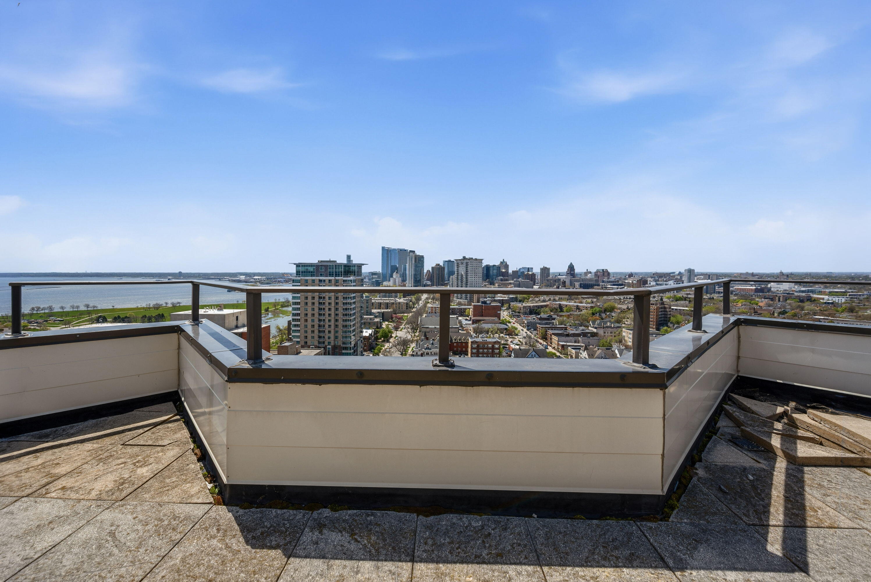 1633 North Prospect Avenue, Unit 5D Milwaukee, WI 53202 - Photo 26 of 38 This rooftop terrace frames the city and lake beautifully, offering a shared outdoor space that feels like a true building bonus.