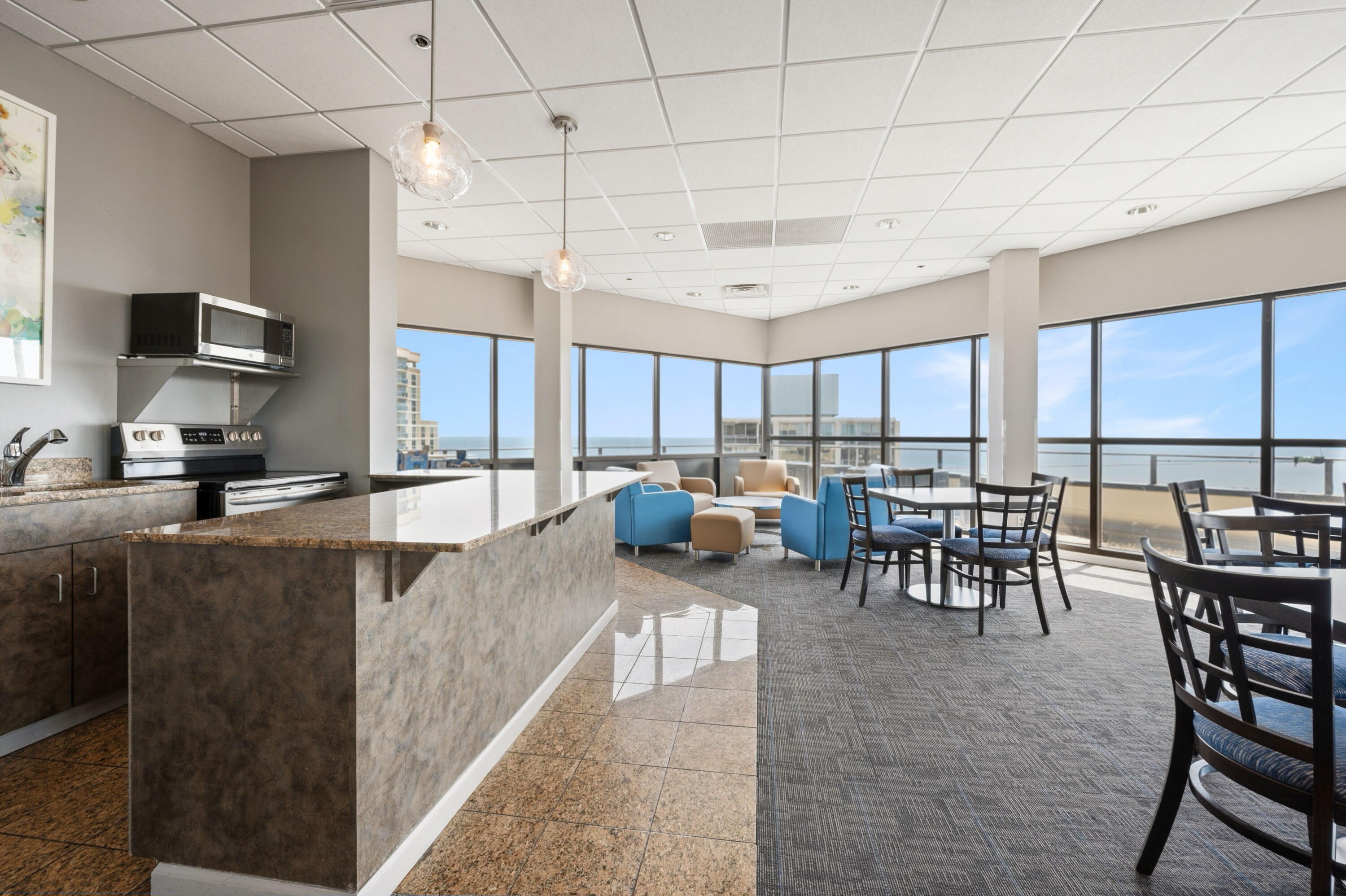 1633 North Prospect Avenue, Unit 5D Milwaukee, WI 53202 - Photo 30 of 38 The 23rd-floor solarium gives owners a bright shared space for casual gatherings, card nights, or a change-of-scenery work session.