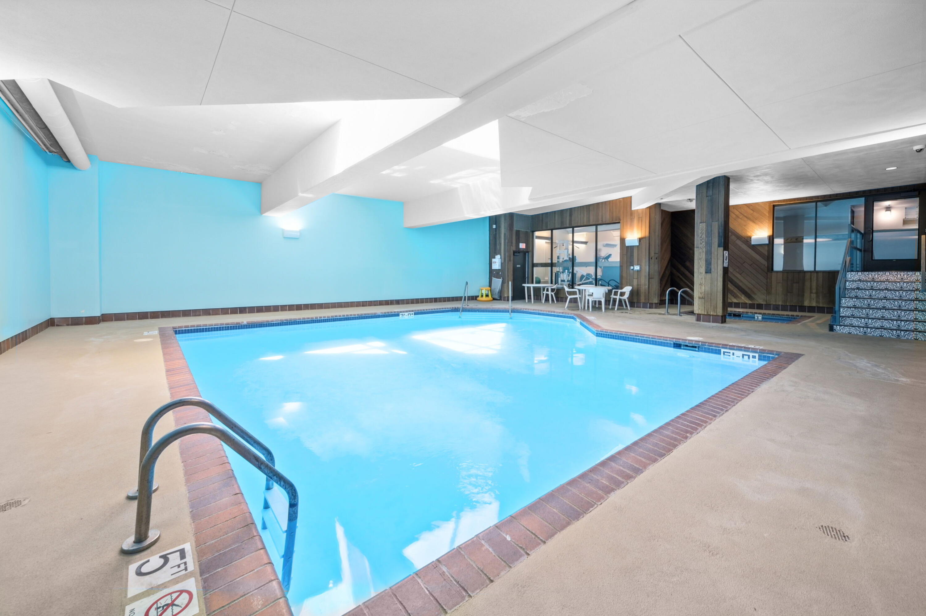 1633 North Prospect Avenue, Unit 5D Milwaukee, WI 53202 - Photo 34 of 38 The indoor pool adds year-round value to Diamond Tower living, pairing well with the fitness center, sauna, and hot tub amenities.