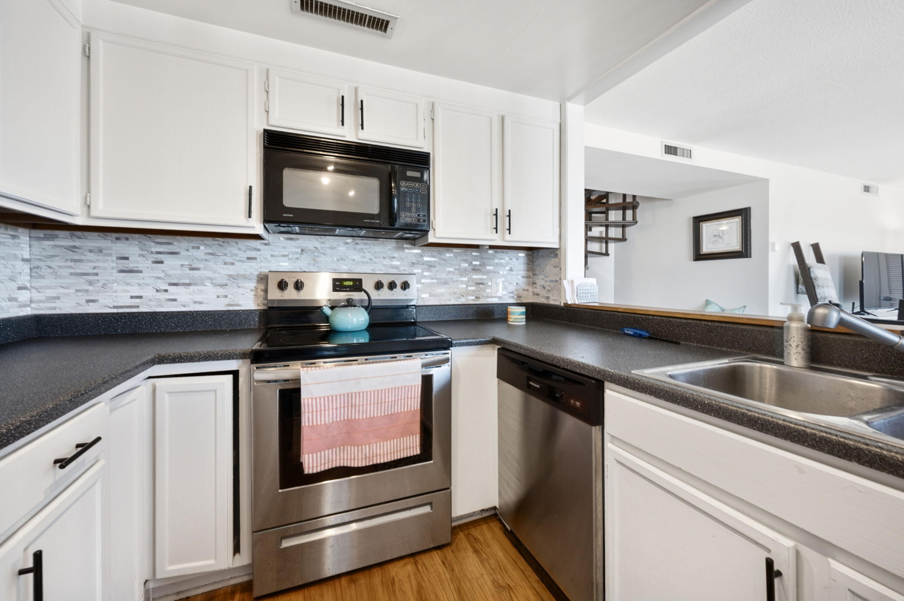 1633 North Prospect Avenue, Unit 5D Milwaukee, WI 53202 - Photo 5 of 38 The kitchen opens toward the main living spaces, creating an easy connection between cooking, dining, and relaxing.