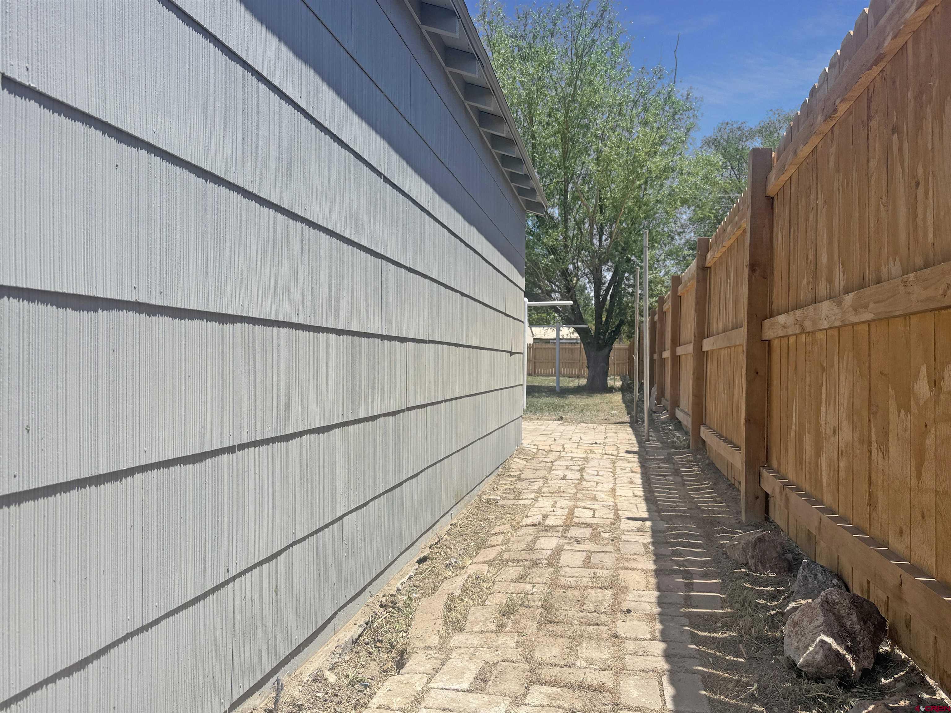 1246 Meeker Street Delta, CO 81416 - Photo 15 of 21 a view of a pathway both side of house