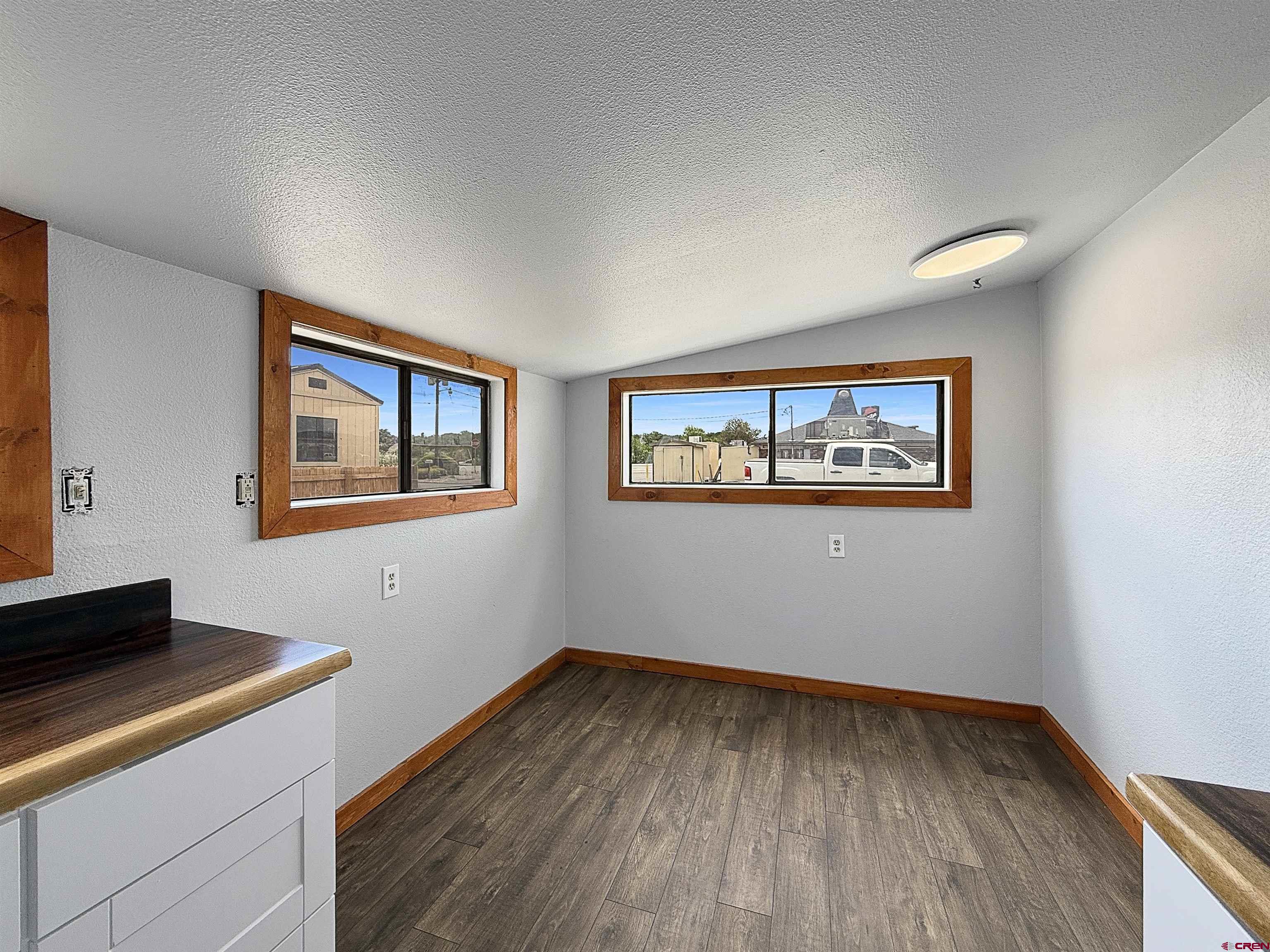 1246 Meeker Street Delta, CO 81416 - Photo 6 of 21 a room with wooden floor and window