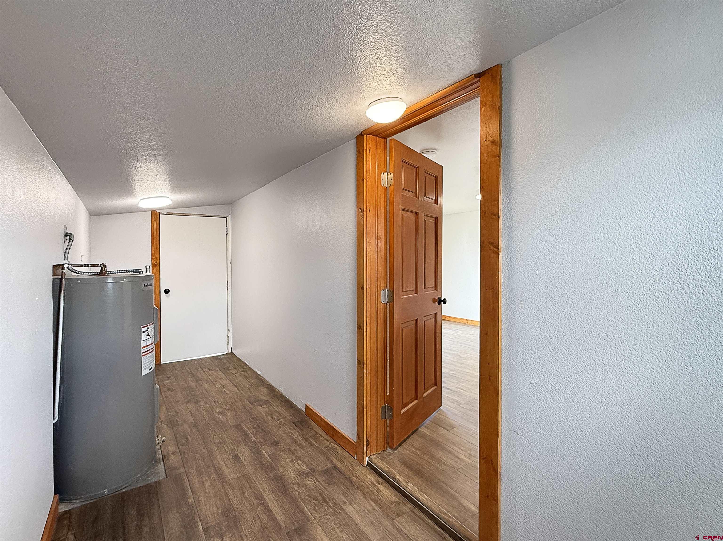 1246 Meeker Street Delta, CO 81416 - Photo 10 of 21 a view of a hallway with wooden floor