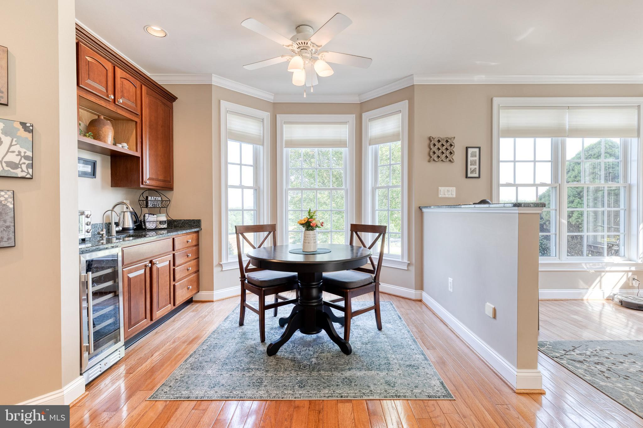 14942 Dover Road Reisterstown, MD 21136 - Photo 18 of 47 a dining room with furniture and wooden floor