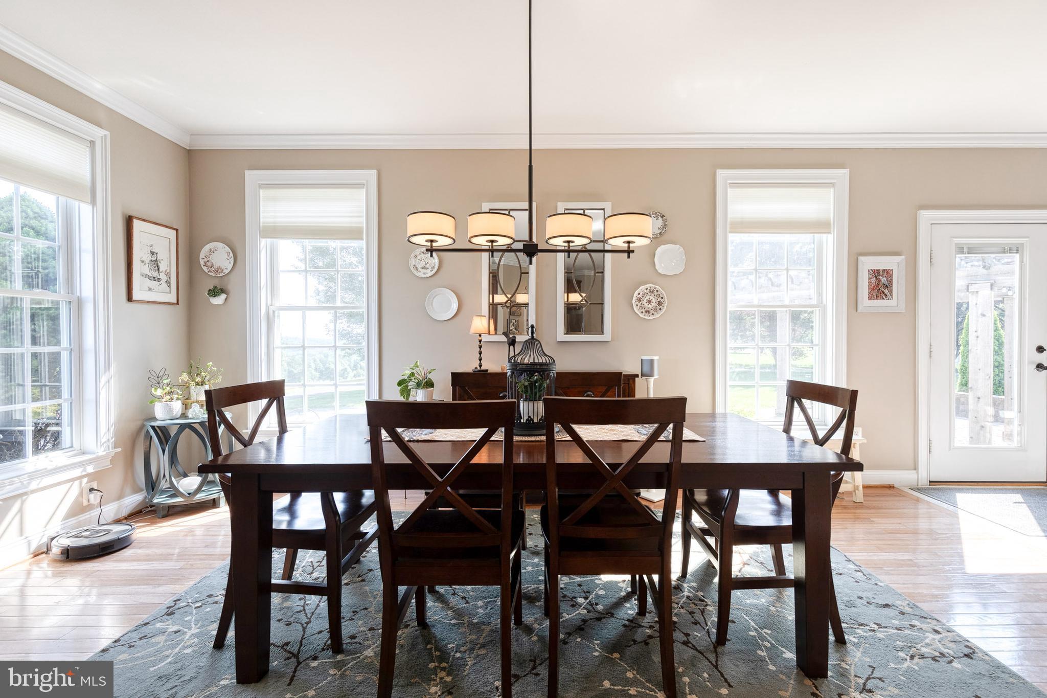 14942 Dover Road Reisterstown, MD 21136 - Photo 22 of 47 a view of a dining room with furniture and wooden floor
