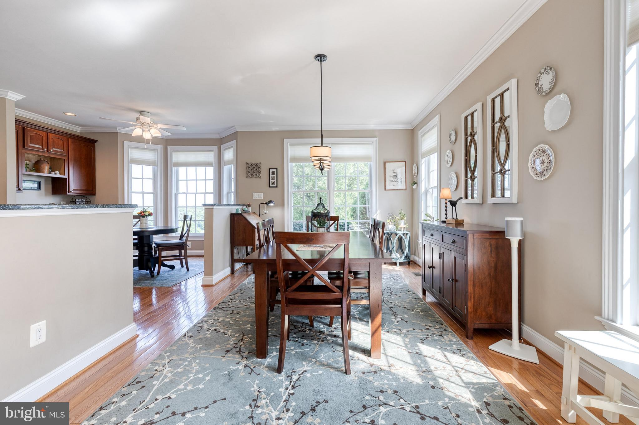 14942 Dover Road Reisterstown, MD 21136 - Photo 23 of 47 a living room with furniture a dining table and a large window