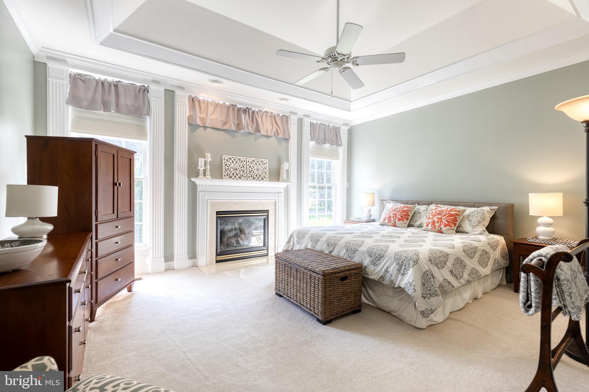 14942 Dover Road Reisterstown, MD 21136 - Photo 26 of 47 a spacious bedroom with a bed and a fireplace