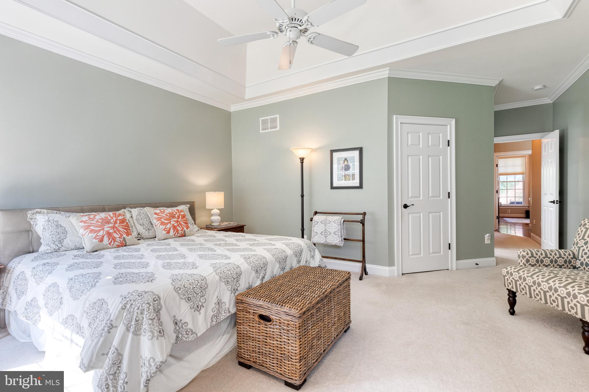 14942 Dover Road Reisterstown, MD 21136 - Photo 28 of 47 a bedroom with a bed and a chandelier