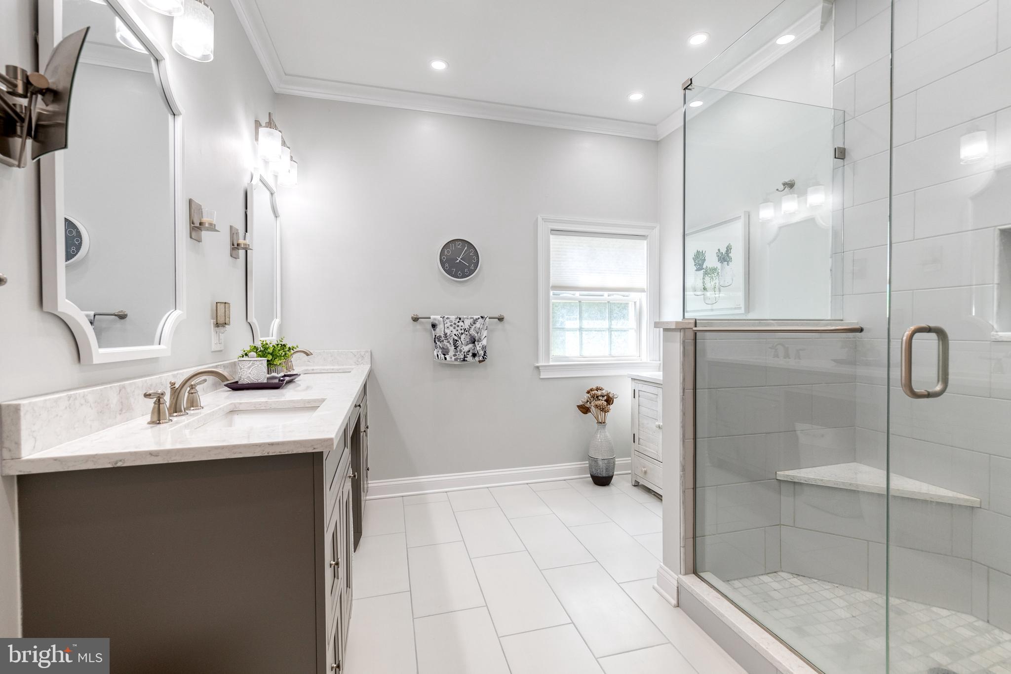 14942 Dover Road Reisterstown, MD 21136 - Photo 29 of 47 a bathroom with a sink shower and a mirror