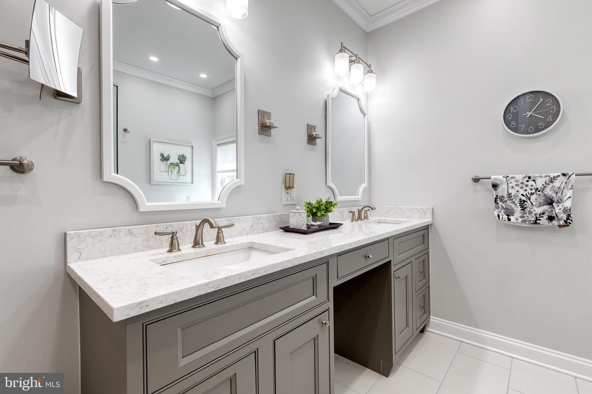 14942 Dover Road Reisterstown, MD 21136 - Photo 31 of 47 a bathroom with a sink and a mirror