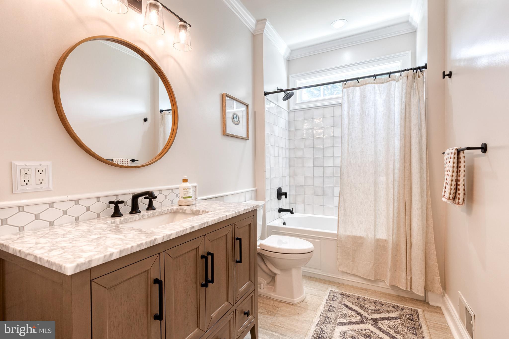 14942 Dover Road Reisterstown, MD 21136 - Photo 33 of 47 a bathroom with a granite countertop sink toilet mirror vanity and shower