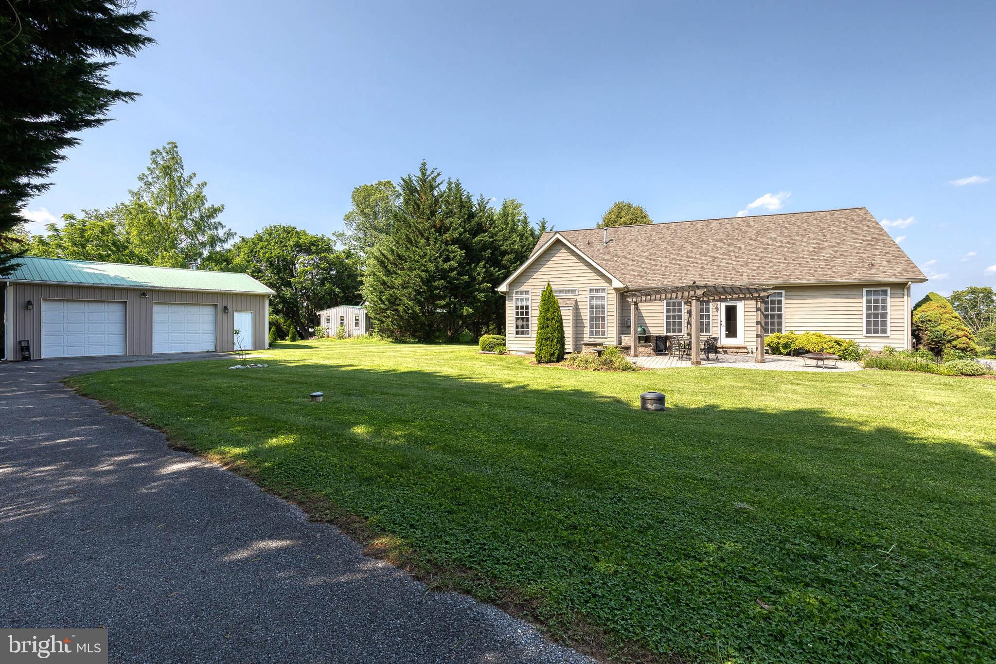14942 Dover Road Reisterstown, MD 21136 - Photo 37 of 47 a front view of a house with a yard