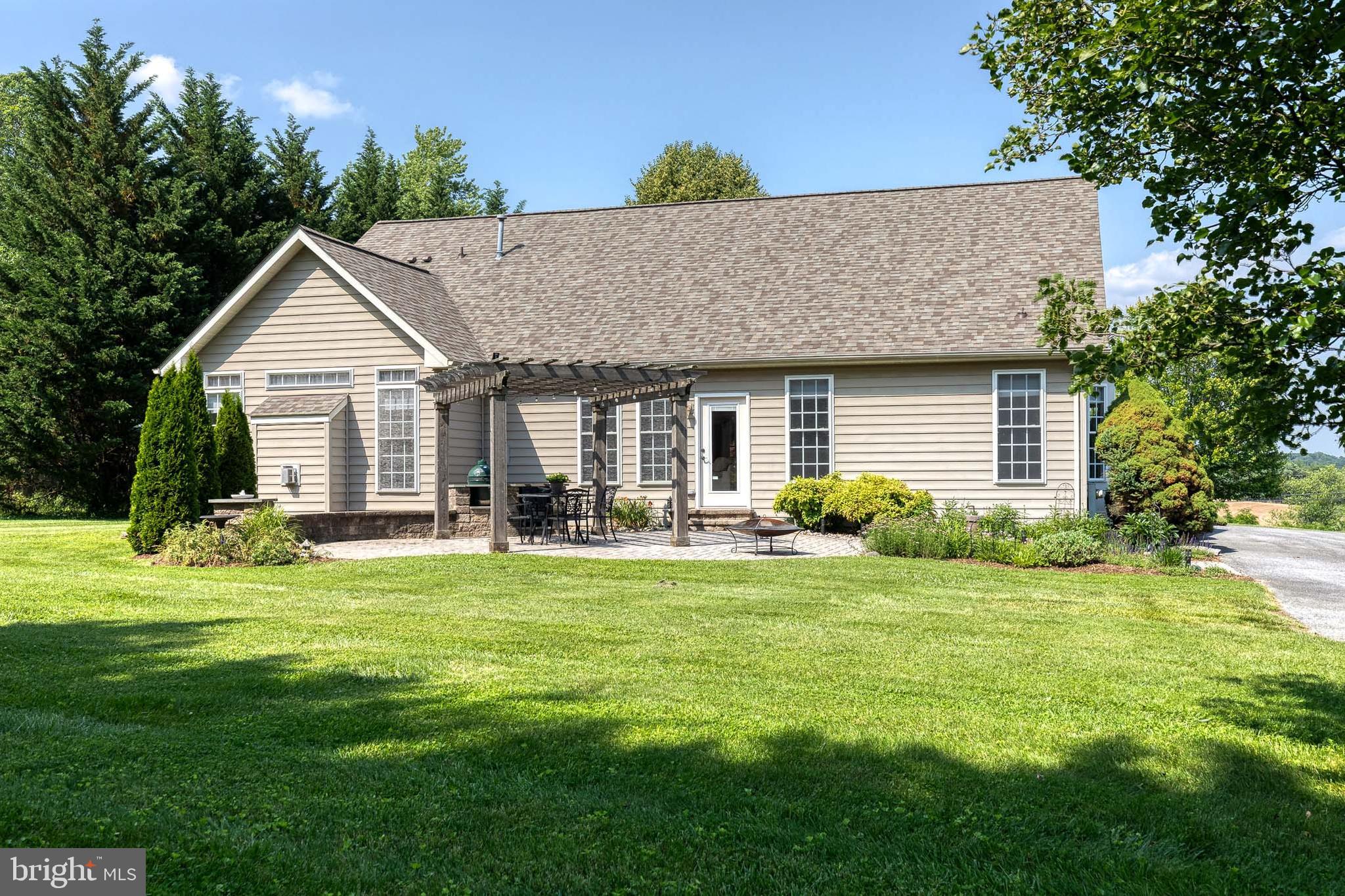 14942 Dover Road Reisterstown, MD 21136 - Photo 39 of 47 a front view of house with yard and green space