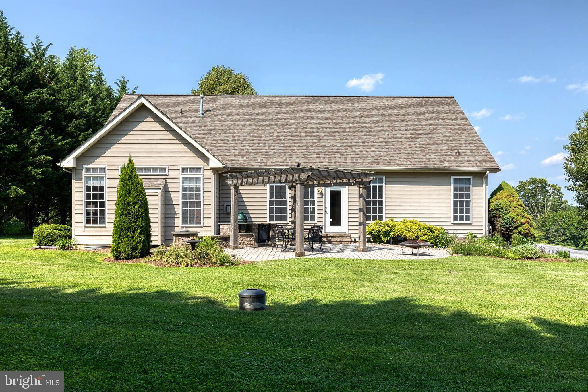 14942 Dover Road Reisterstown, MD 21136 - Photo 41 of 47 a view of a house with a yard and sitting area