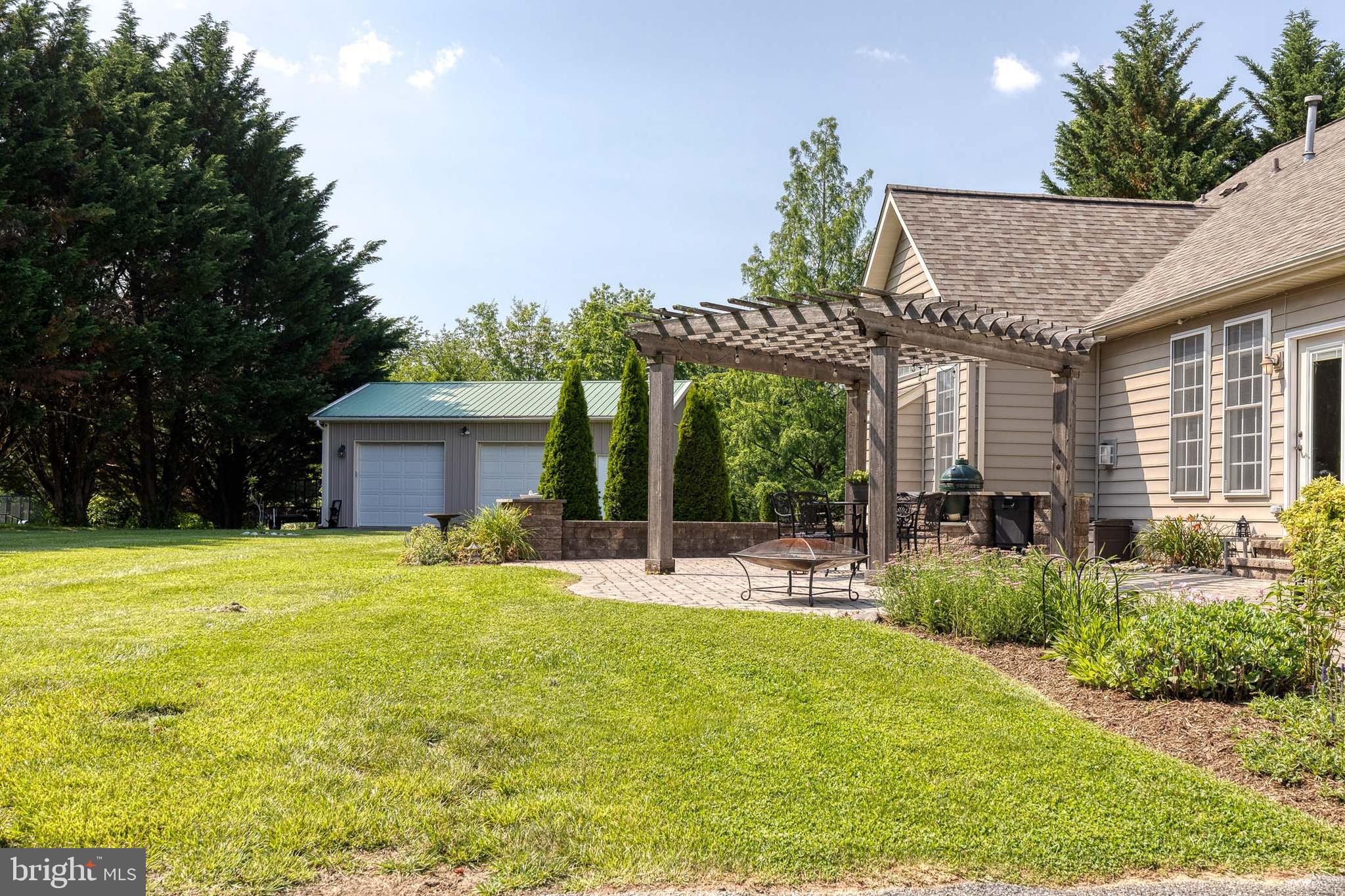 14942 Dover Road Reisterstown, MD 21136 - Photo 45 of 47 a view of a house with backyard and sitting area