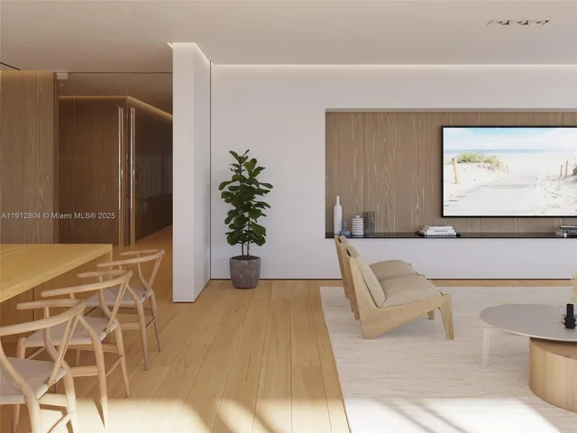 a living room with a couch and a potted plant