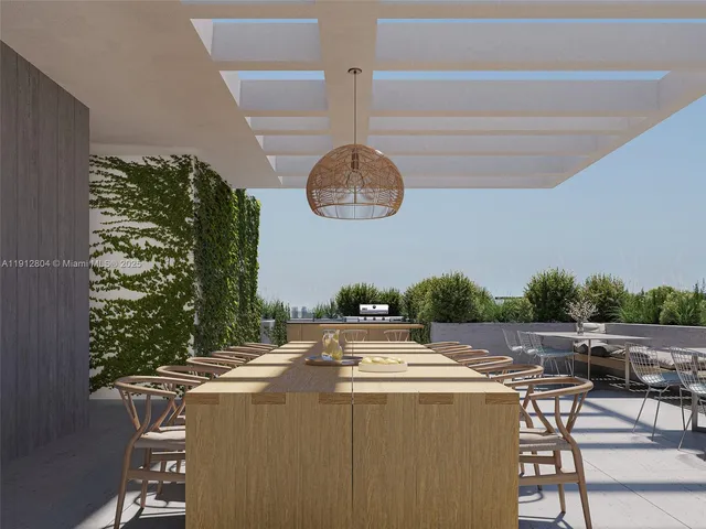 a view of a dining table and chairs in a patio