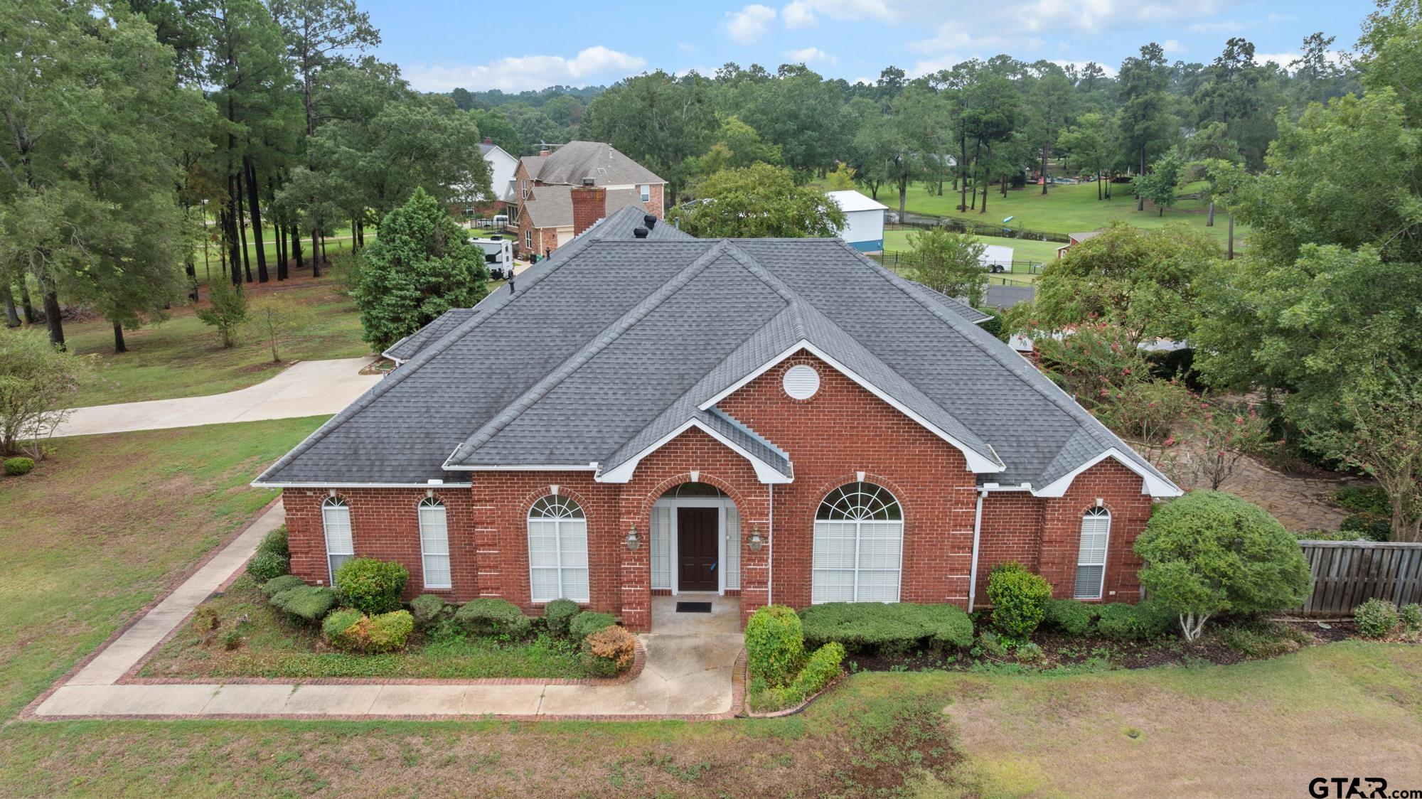 210 Lavender Lane Longview, TX 75605 - Photo 1 of 36 a front view of a house with a yard