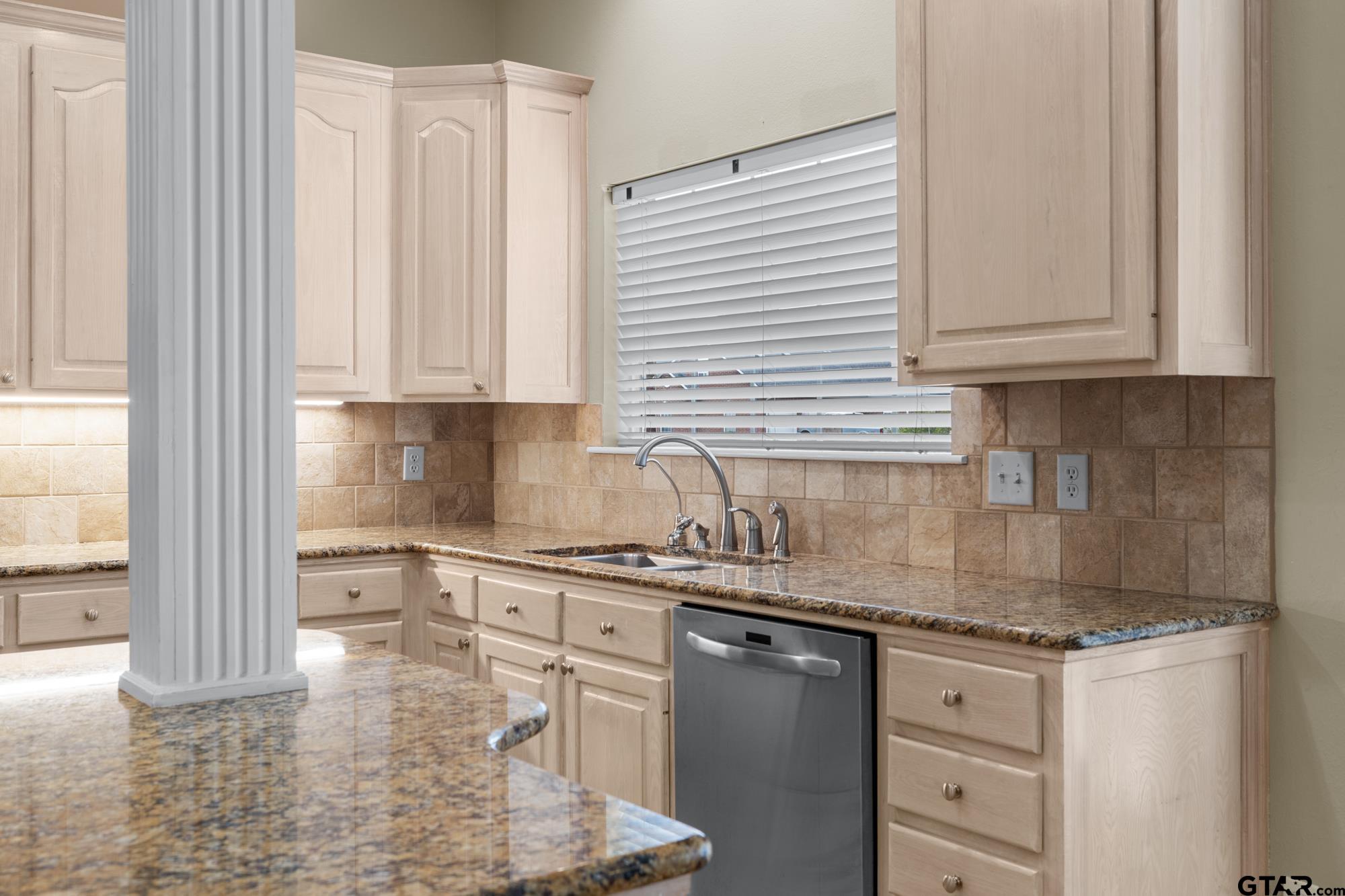 210 Lavender Lane Longview, TX 75605 - Photo 14 of 36 a kitchen with stainless steel appliances granite countertop a sink stove and cabinets