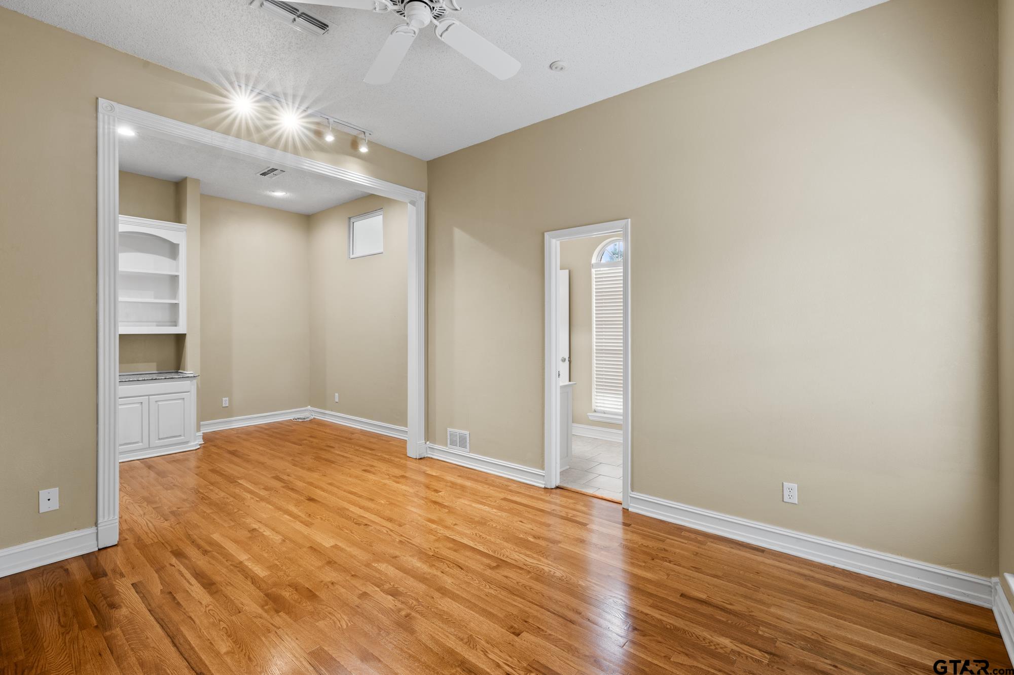 210 Lavender Lane Longview, TX 75605 - Photo 18 of 36 a view of an empty room with wooden floor