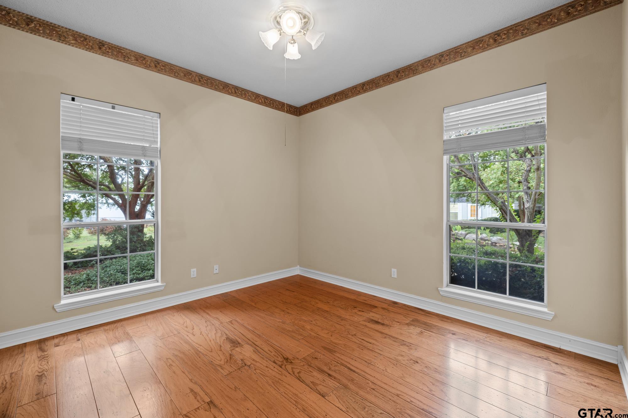 210 Lavender Lane Longview, TX 75605 - Photo 24 of 36 a view of empty room with wooden floor and fan