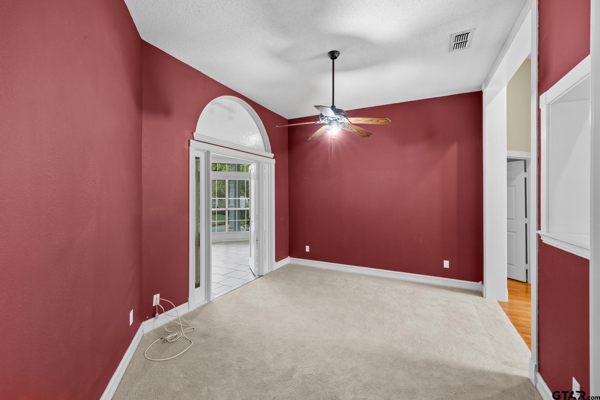 210 Lavender Lane Longview, TX 75605 - Photo 8 of 36 a view of a livingroom with a chandelier fan and a window
