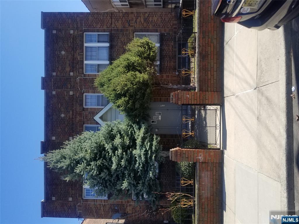 130-2 Rutherford Place, Unit 2L North Arlington, NJ 07031 - Photo 1 of 11 a view of building with outdoor space and seating space