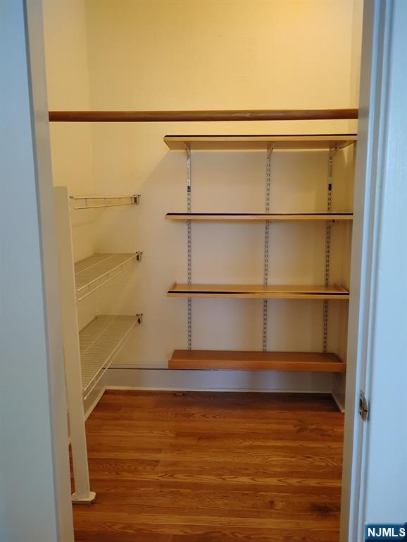 130-2 Rutherford Place, Unit 2L North Arlington, NJ 07031 - Photo 6 of 11 a view of walk in closet with empty racks