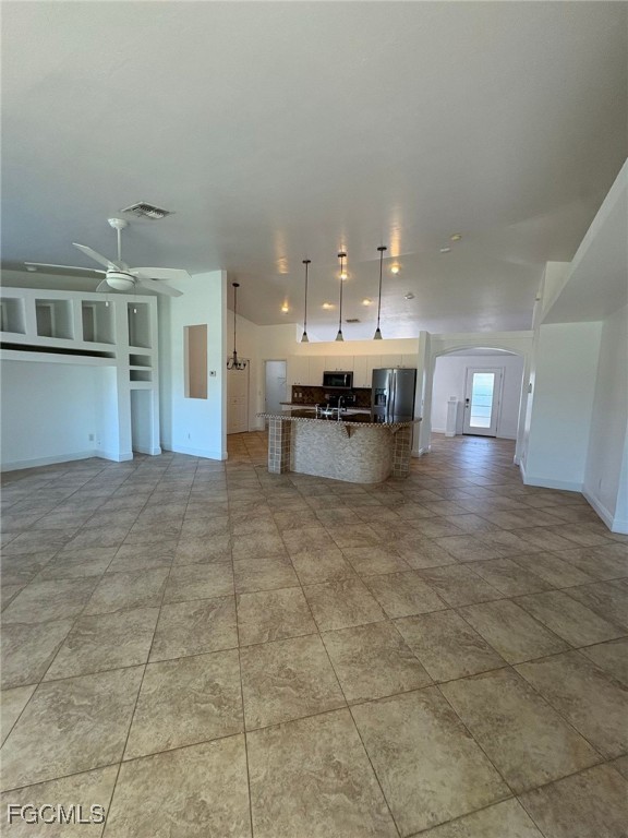 1502 Southwest 20th Avenue Cape Coral, FL 33991 - Photo 12 of 31 a view of a living room and kitchen