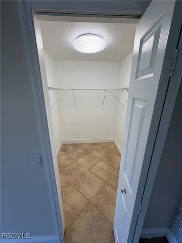 a view of storage and utility room with a sink
