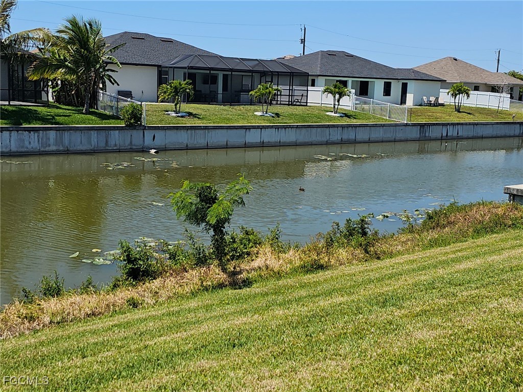 1502 Southwest 20th Avenue Cape Coral, FL 33991 - Photo 30 of 31 an aerial view of a house with a lake view