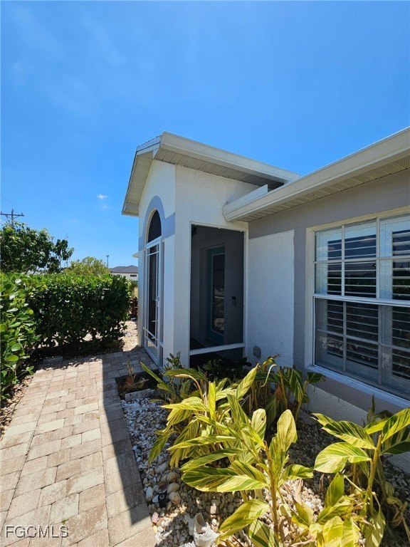 1502 Southwest 20th Avenue Cape Coral, FL 33991 - Photo 3 of 31 a front view of a house with a yard