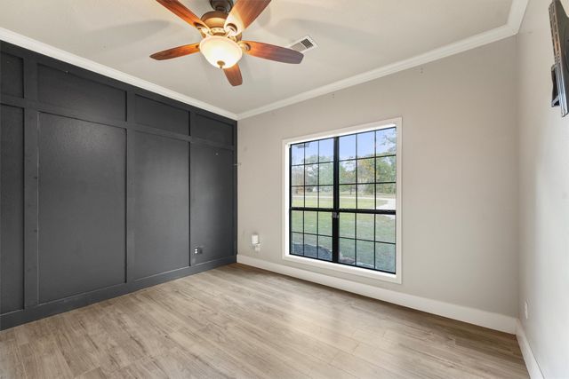 a bathroom with a granite countertop sink toilet a mirror and shower