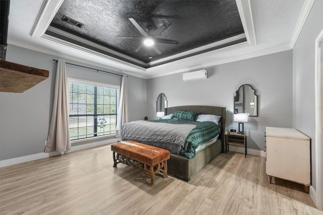 an empty room with fan and windows