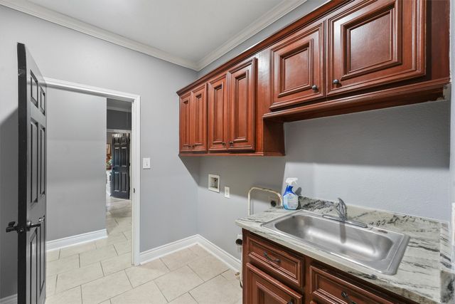 a kitchen with stainless steel appliances granite countertop a sink and dishwasher refrigerator a microwave oven