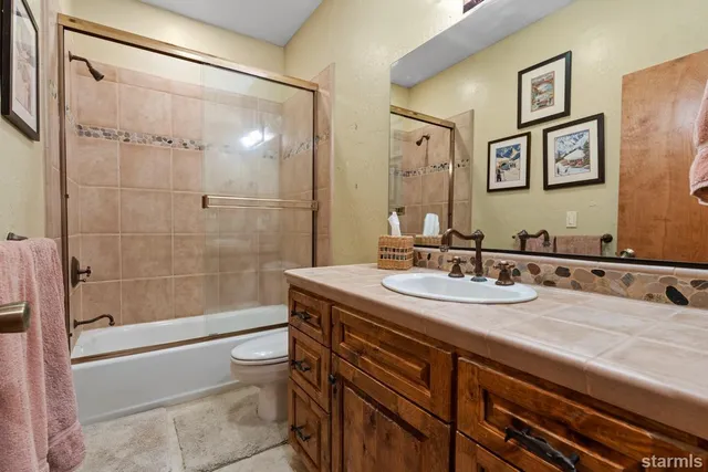 a stove top oven sitting inside of a kitchen